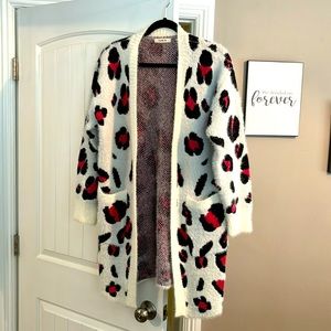 Love in cardigan size m/l with cute pink and black leopard spots.